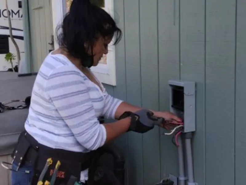 Licensed electrician wiring an exterior subpanel in South Monrovia Island