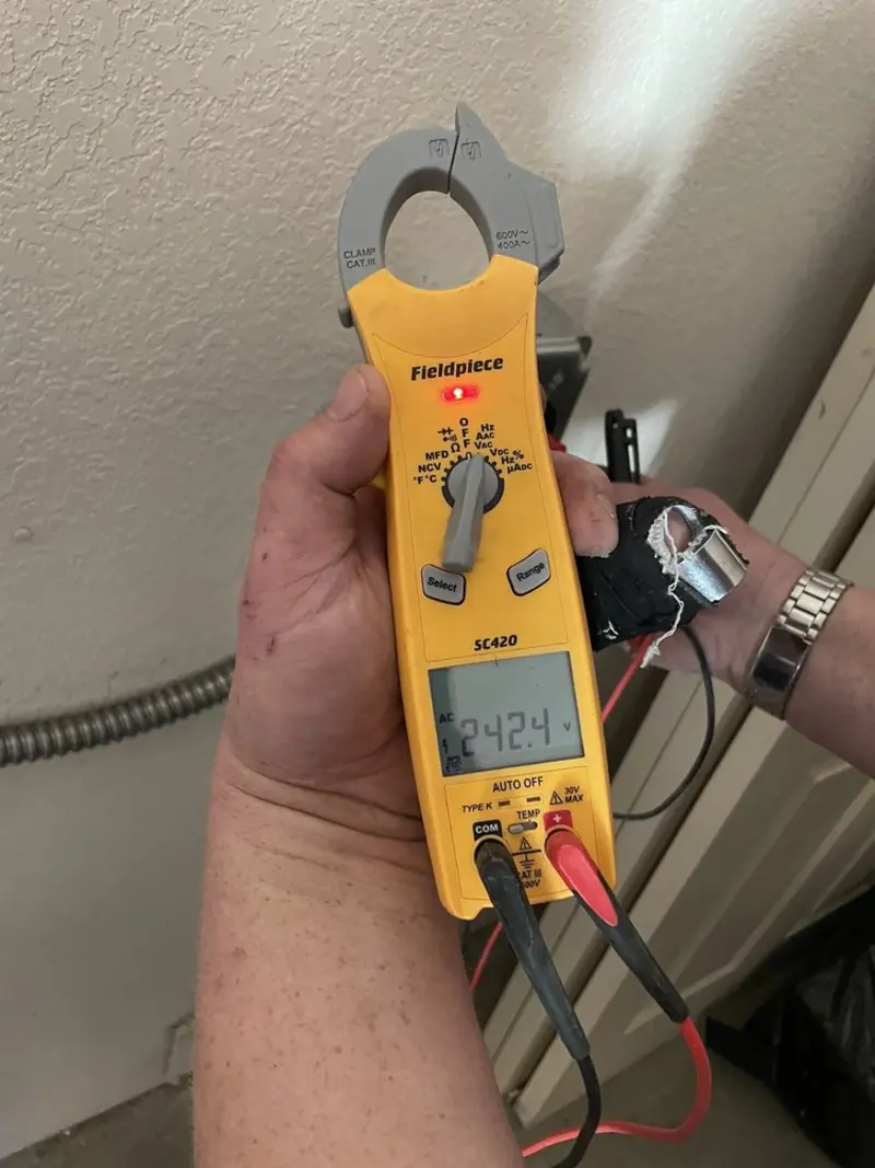 Voltage testing with clamp meter during Electrical Installation Services in South Monrovia Island